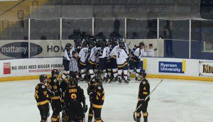 The men's hockey team celebrates its win in overtime over Waterloo. Photo Andrew Roberts/ Ryersonian Staff