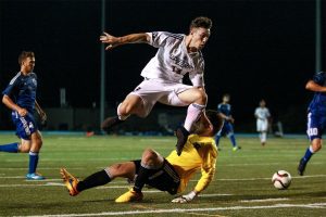 ORONTO , ON - Sep 16, 2015 : Ontario University Athletics Mens Soccer game action between the Ryerson Rams and the University of Ontario Institute of Technology Ridgebacks. Jackson Tooke #13 of Ryerson Rams (Courtesy Alex D'Addese/Ryerson Rams Athletics)