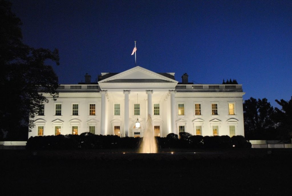 The White House in Washington D.C. brightly lit at night.