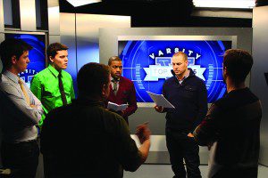 Crew and cast members of Varsity Life going over the show's script. (Melissa Wronzberg/Ryersonian Staff)