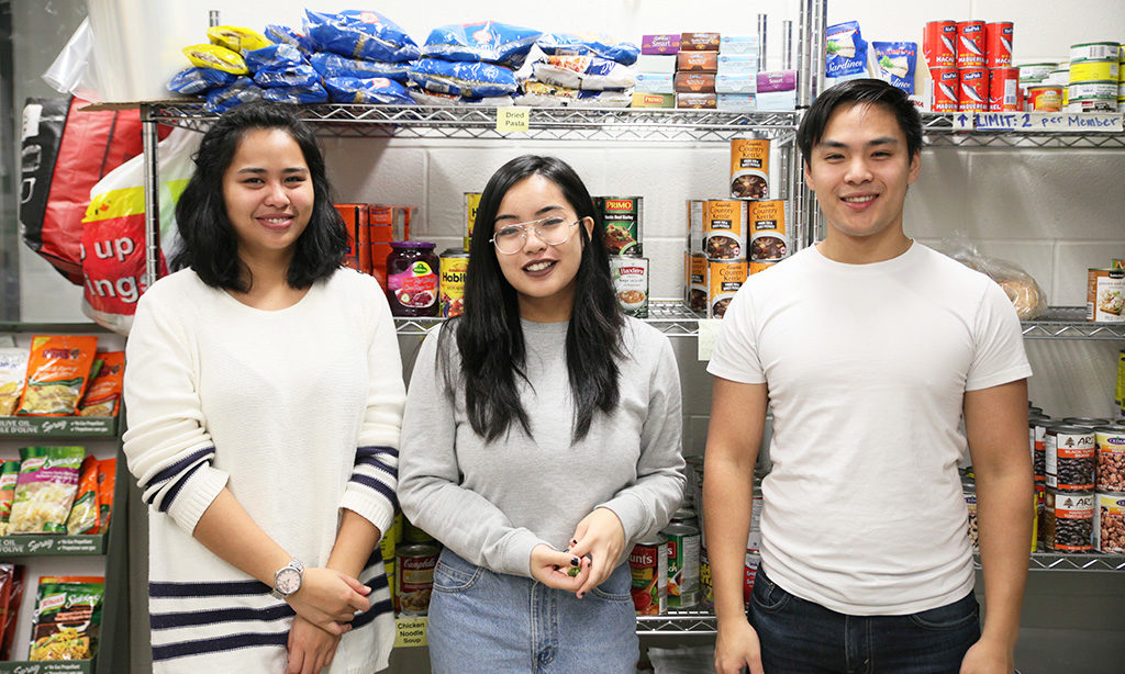 Volunteers at the Ryerson Good Food Centre: Zennia Seneres, Renee Labrido and Evan Tang. (Samraweet Yohannes)