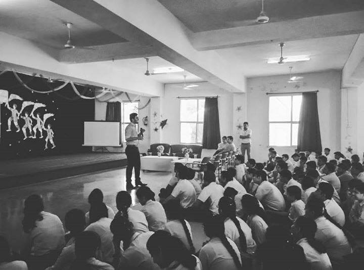 Speaking to a group of students at a high school in India telling my story (Abhi Raheja)